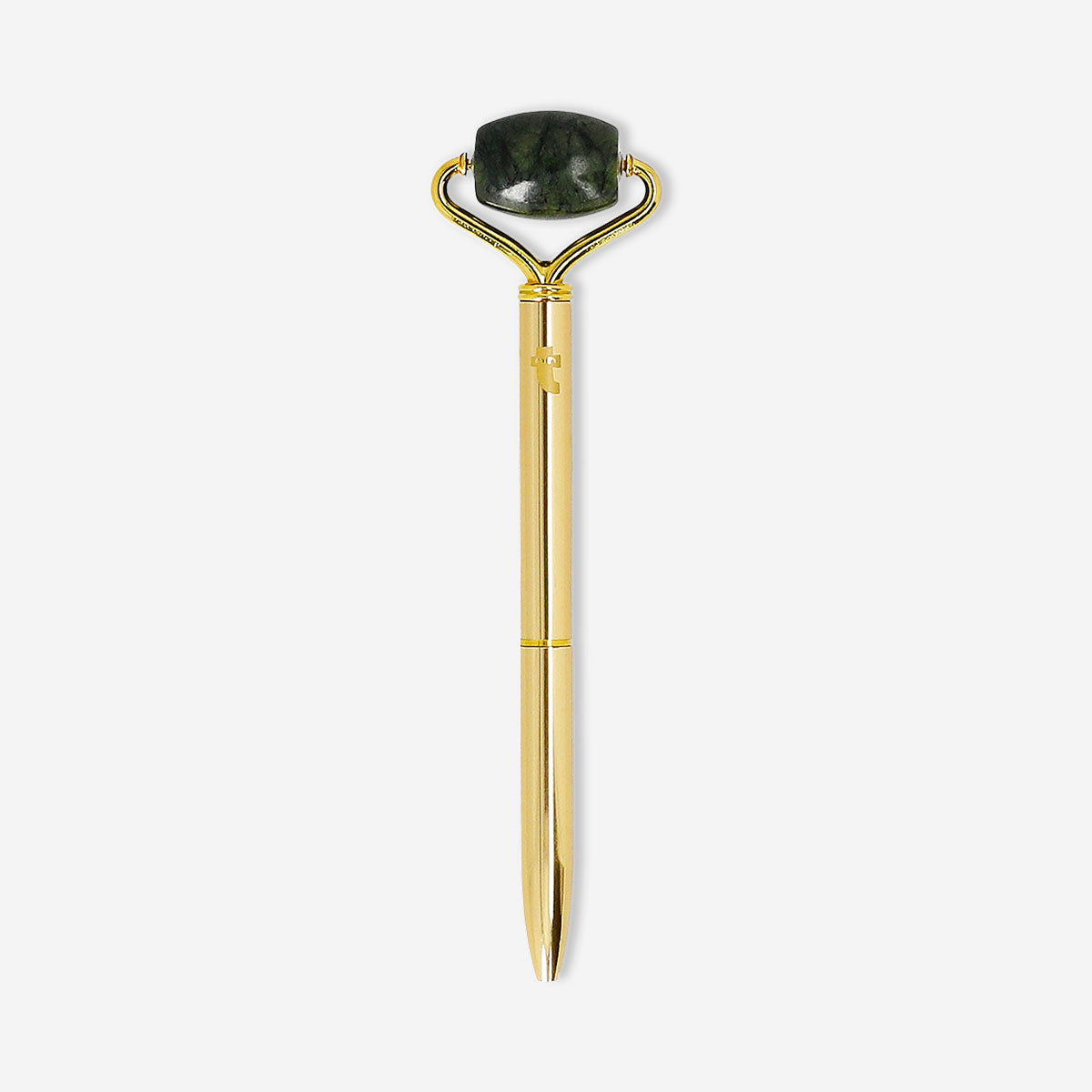 Flying Tiger Copenhagen gold ballpoint pen with built-in facial roller, ideal for office use and quick skincare refreshes.