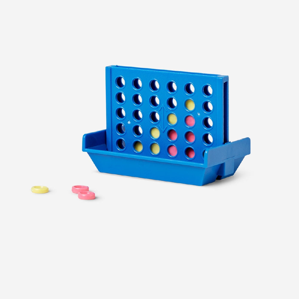 Mini Four in a Row game from Flying Tiger Copenhagen showing colorful plastic game pieces and game board.