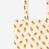 Textile tote bag featuring gingerbread people design from Flying Tiger Copenhagen, with colorful festive holiday pattern.