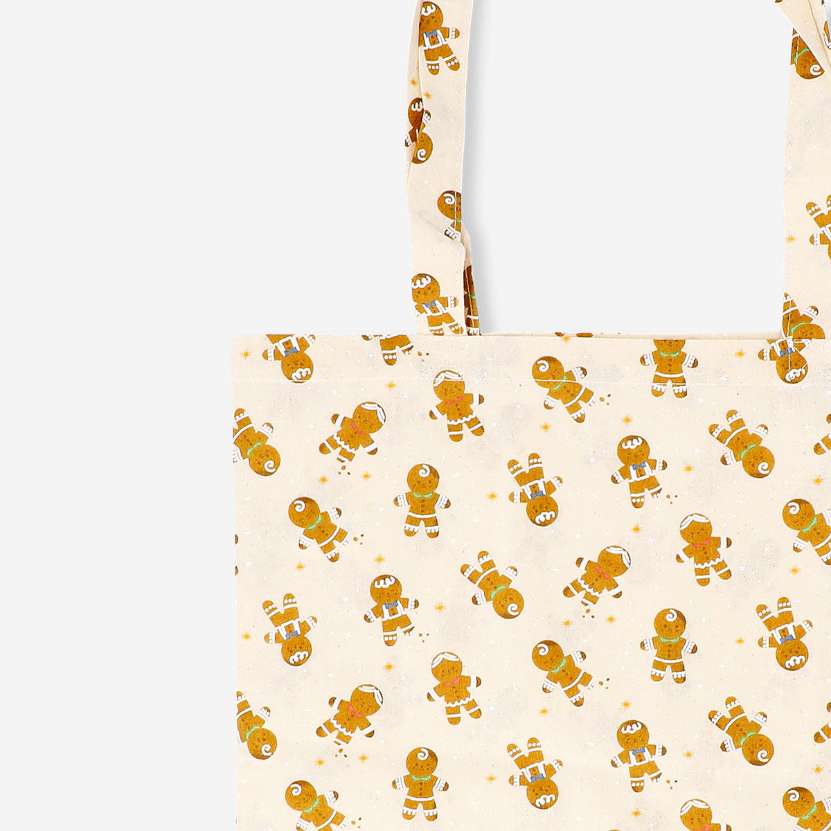 Textile tote bag featuring gingerbread people design from Flying Tiger Copenhagen, with colorful festive holiday pattern.