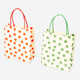 Two office gift bags with heart designs from Flying Tiger Copenhagen, featuring colorful paper bags for special occasions.