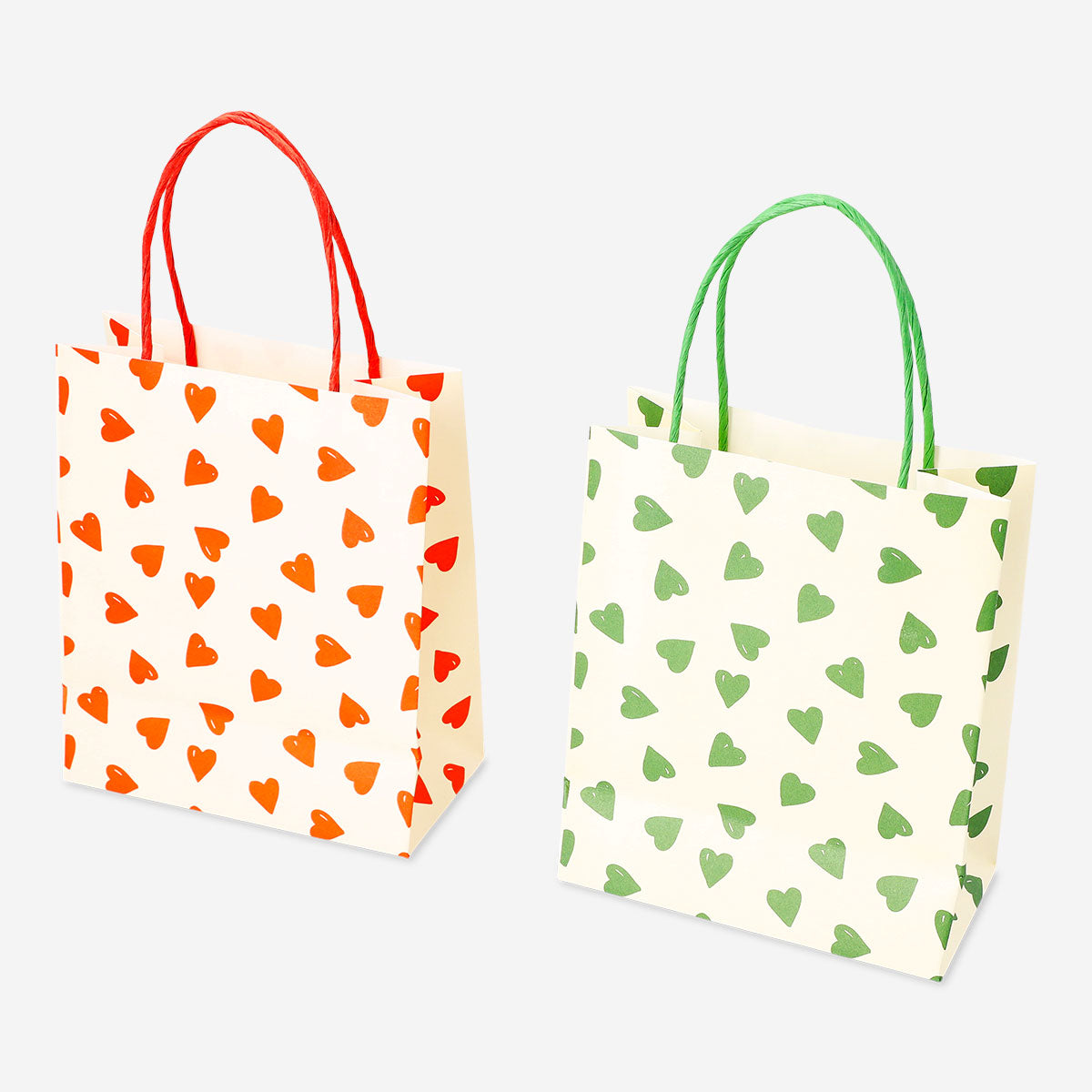 Two office gift bags with heart designs from Flying Tiger Copenhagen, featuring colorful paper bags for special occasions.