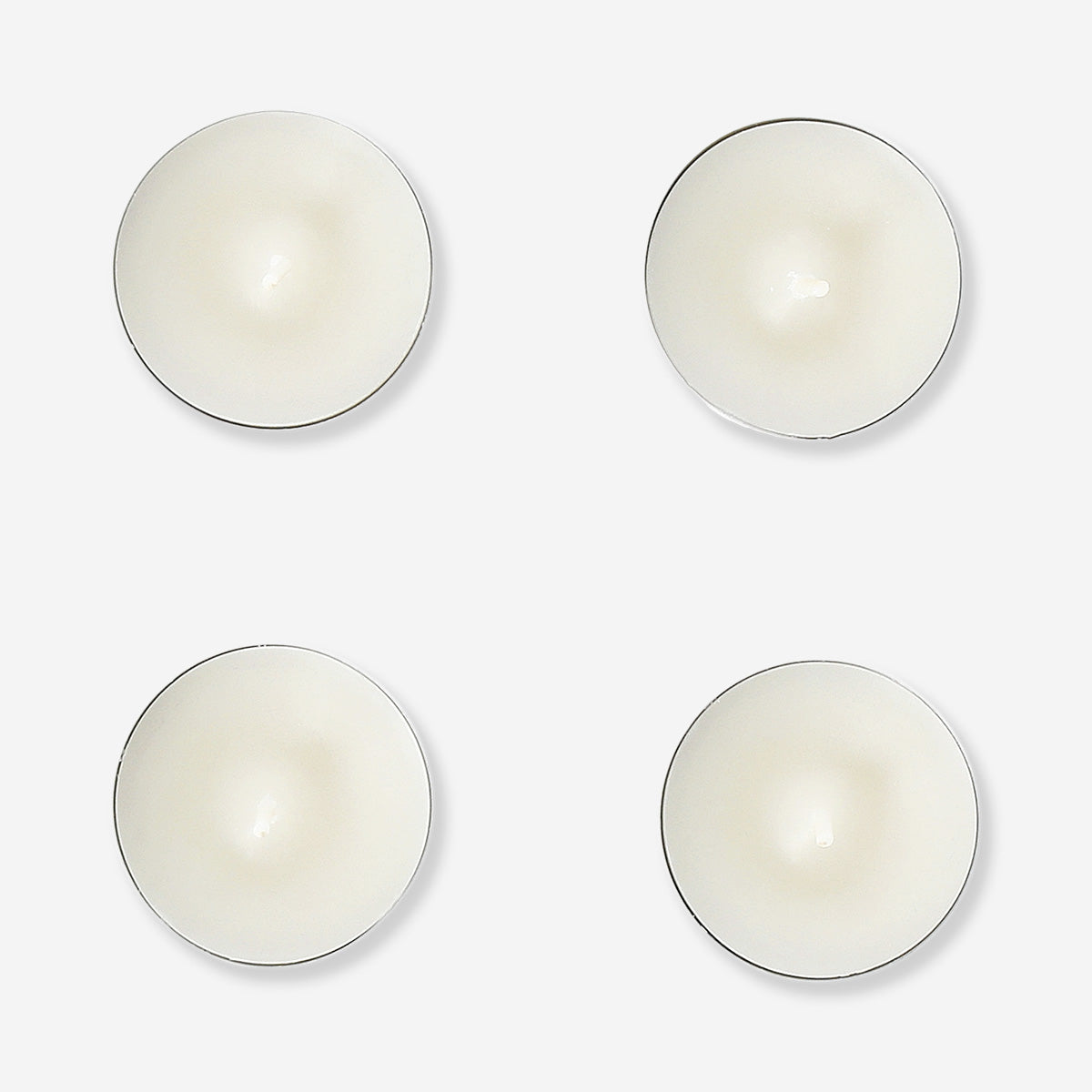 Set of 18 vanilla-scented tealights for home ambiance from Flying Tiger Copenhagen, displayed in a neat arrangement.
