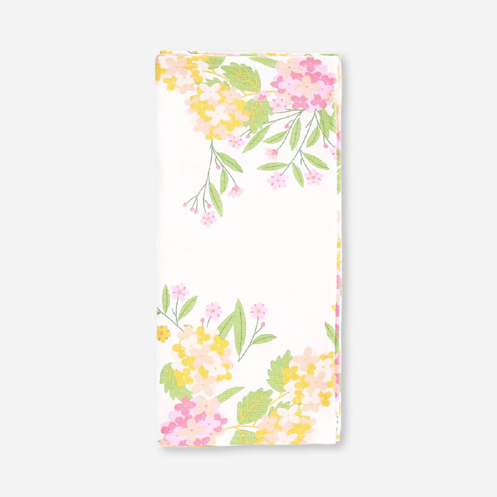 Floral table runner from Flying Tiger Copenhagen, 35x130 cm, featuring colorful flower patterns on lightweight fabric.