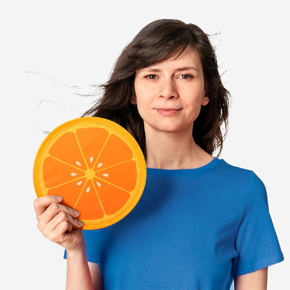 Orange print foldable textile fan by Flying Tiger Copenhagen, compact and lightweight for easy cooling and stylish use.