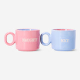 Set of two pastel cortado mugs with Christmas text from Flying Tiger Copenhagen, ideal for festive coffee or tea.
