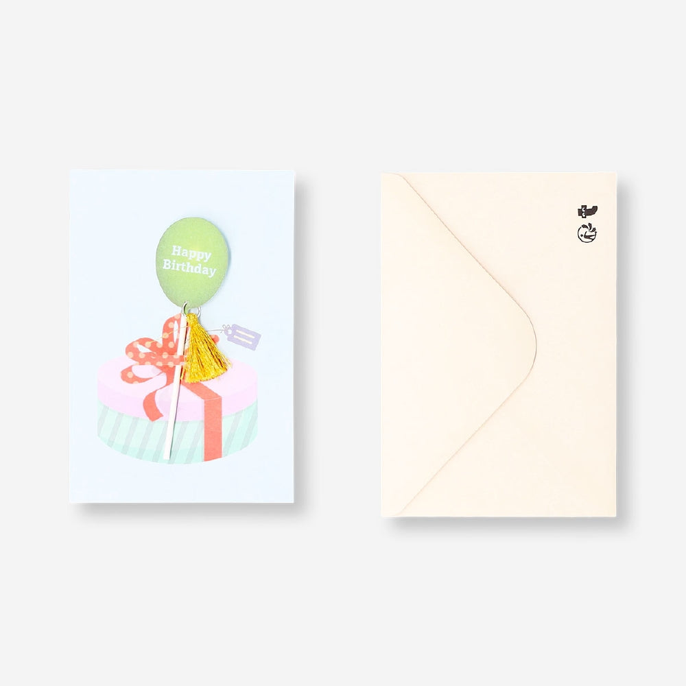 Flying Tiger Copenhagen birthday card featuring a balloon with tassel attachment, suitable for office celebrations.