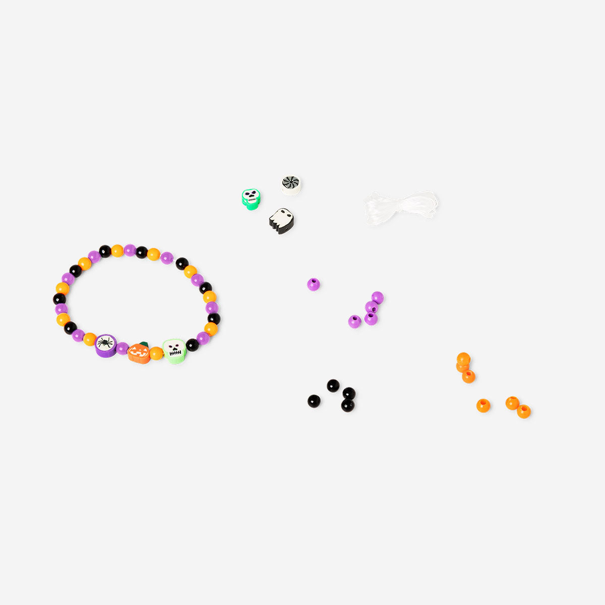 Colorful bead set in a coffin-shaped container from Flying Tiger Copenhagen, ideal for hobby jewelry making and craft projects.