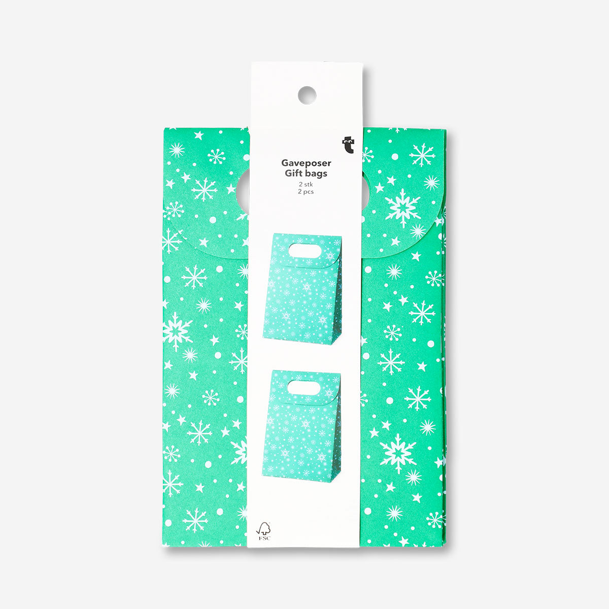 Two green office gift bags with white snowflake designs by Flying Tiger Copenhagen, suitable for holiday gifting.