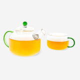 Glass tea pot with colorful handle, 400ml capacity, perfect for brewing and serving tea in a modern kitchen.