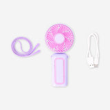 Purple and pink handheld fan with strap, Flying Tiger Copenhagen gadget, compact and portable for cooling on the go.