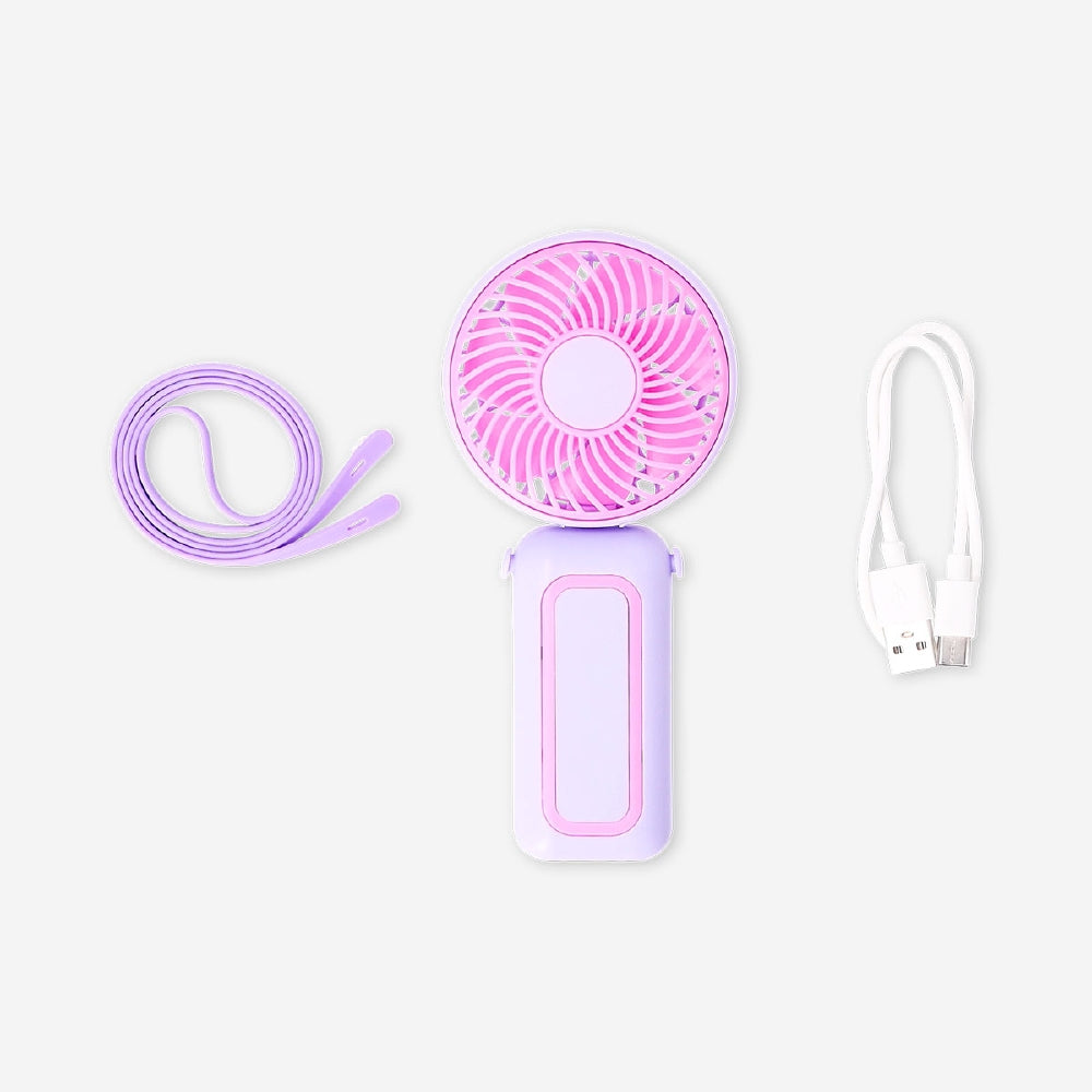 Purple and pink handheld fan with strap, Flying Tiger Copenhagen gadget, compact and portable for cooling on the go.
