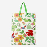 Tropical print gift bag from Flying Tiger Copenhagen, 25x33 cm, perfect for office gifts with vibrant tropical floral design.