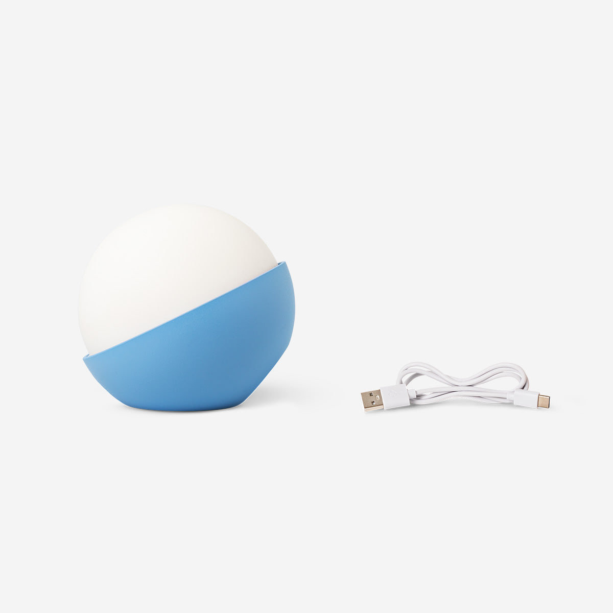Blue globe-shaped Cosy lamp by Flying Tiger Copenhagen, soft ambient lighting for home decor.