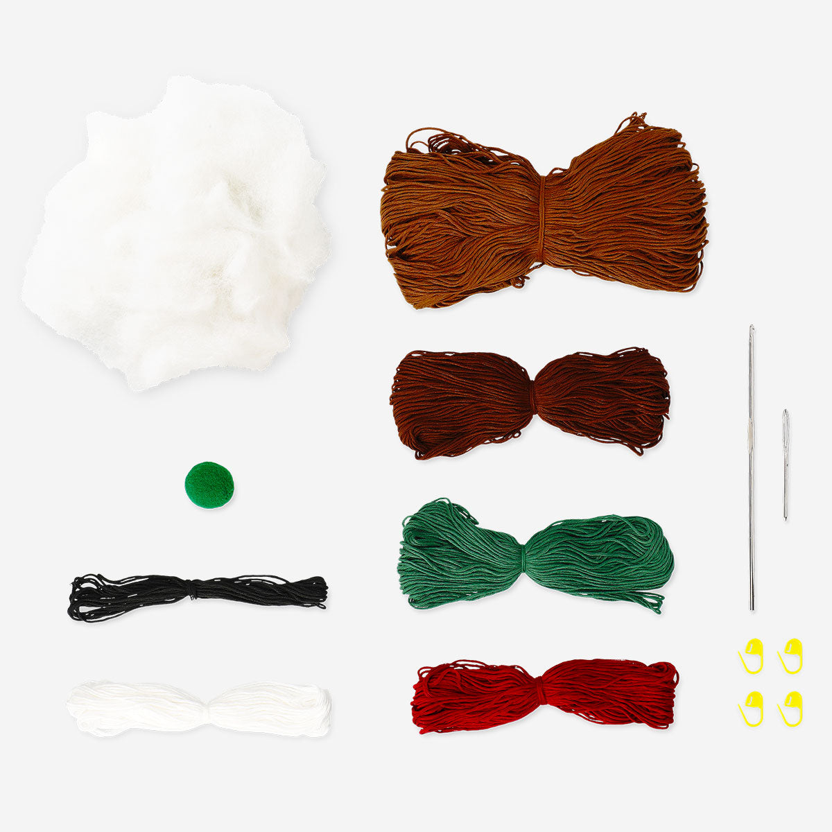 DIY crochet Christmas sausage dog hobby kit by Flying Tiger Copenhagen featuring colorful yarn and crochet tools.