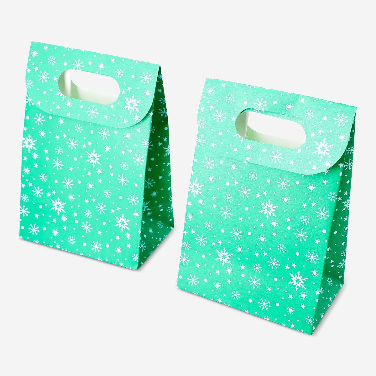 Two green Flying Tiger Copenhagen gift bags with white snowflake designs for office gifting, shown with handles and festive pattern.