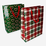Two Christmas print coated gift bags from Flying Tiger Copenhagen, perfect for office gift wrapping.