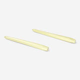 Two gold dinner candles from Flying Tiger Copenhagen, elegant tapered candles for home decor or table settings.