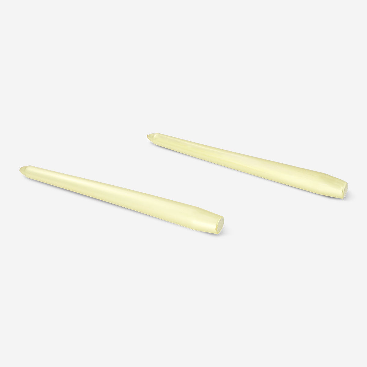 Two gold dinner candles from Flying Tiger Copenhagen, elegant tapered candles for home decor or table settings.
