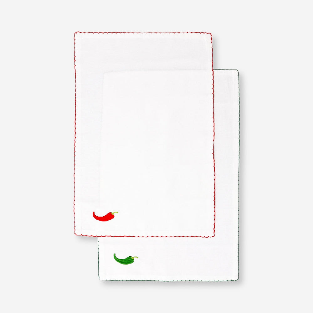 Set of two embroidered chili-themed placemats for kitchen table decor, featuring colorful chili designs by Flying Tiger Copenhagen.