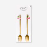 Pair of gold dessert forks with cherry decorations from Flying Tiger Copenhagen, perfect for elegant kitchen serving.