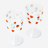 Two clear glass wine glasses with strawberry print, ideal for parties, by Flying Tiger Copenhagen.