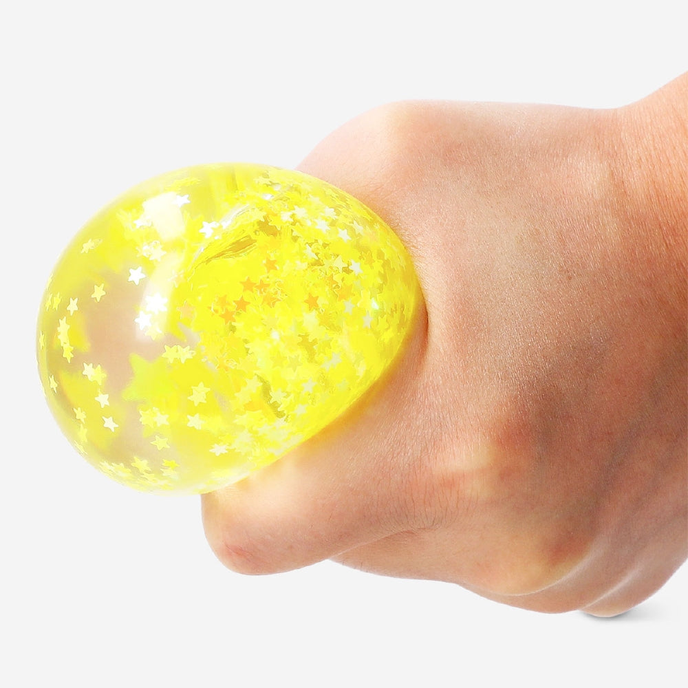 Gold star fidget ball gadget by Flying Tiger Copenhagen, featuring a shiny, star-patterned design for sensory play and stress relief.
