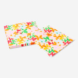 Set of 16 floral and scalloped edge party napkins by Flying Tiger Copenhagen, featuring colorful floral patterns on white paper.