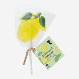 Lemon flavored Flying Tiger Copenhagen lemon lollipop with bright yellow color and classic round shape.