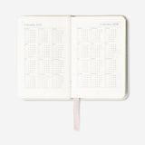 Fabric cover weekly diary 2027 with Flying Tiger Copenhagen branding, featuring a sleek, professional office design in the image.
