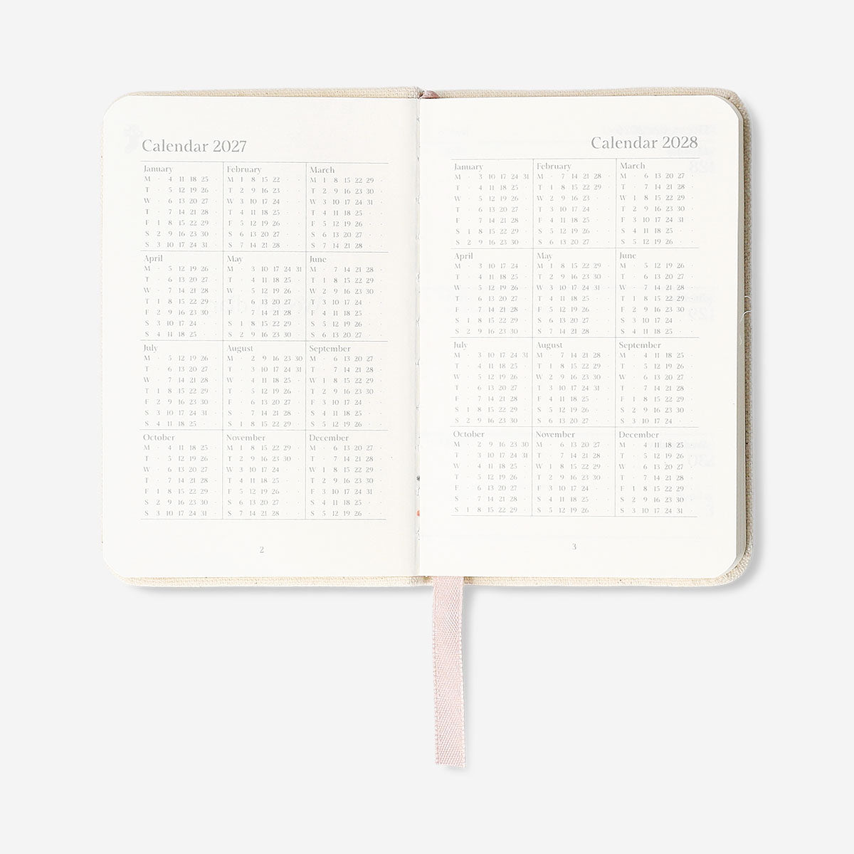 Fabric cover weekly diary 2027 with Flying Tiger Copenhagen branding, featuring a sleek, professional office design in the image.