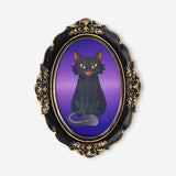 Oval framed haunted picture gadget by Flying Tiger Copenhagen, featuring spooky artwork perfect for Halloween decor.