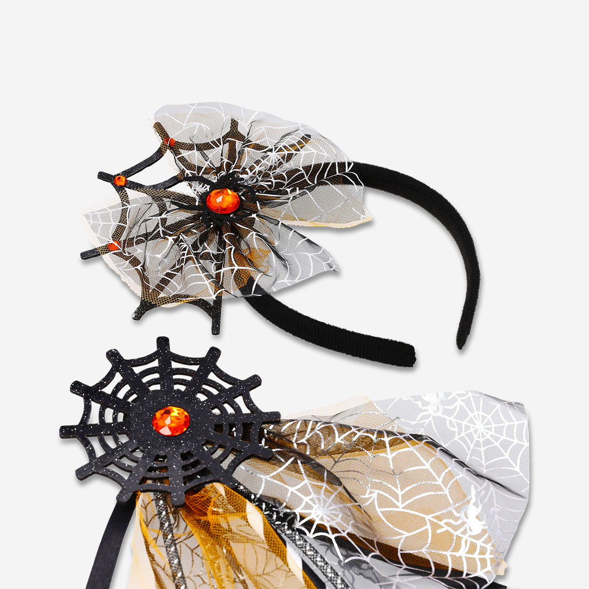 Kids' spider web hairband with wand for party fun, featuring black web design and a small wand accessory, by Flying Tiger Copenhagen.