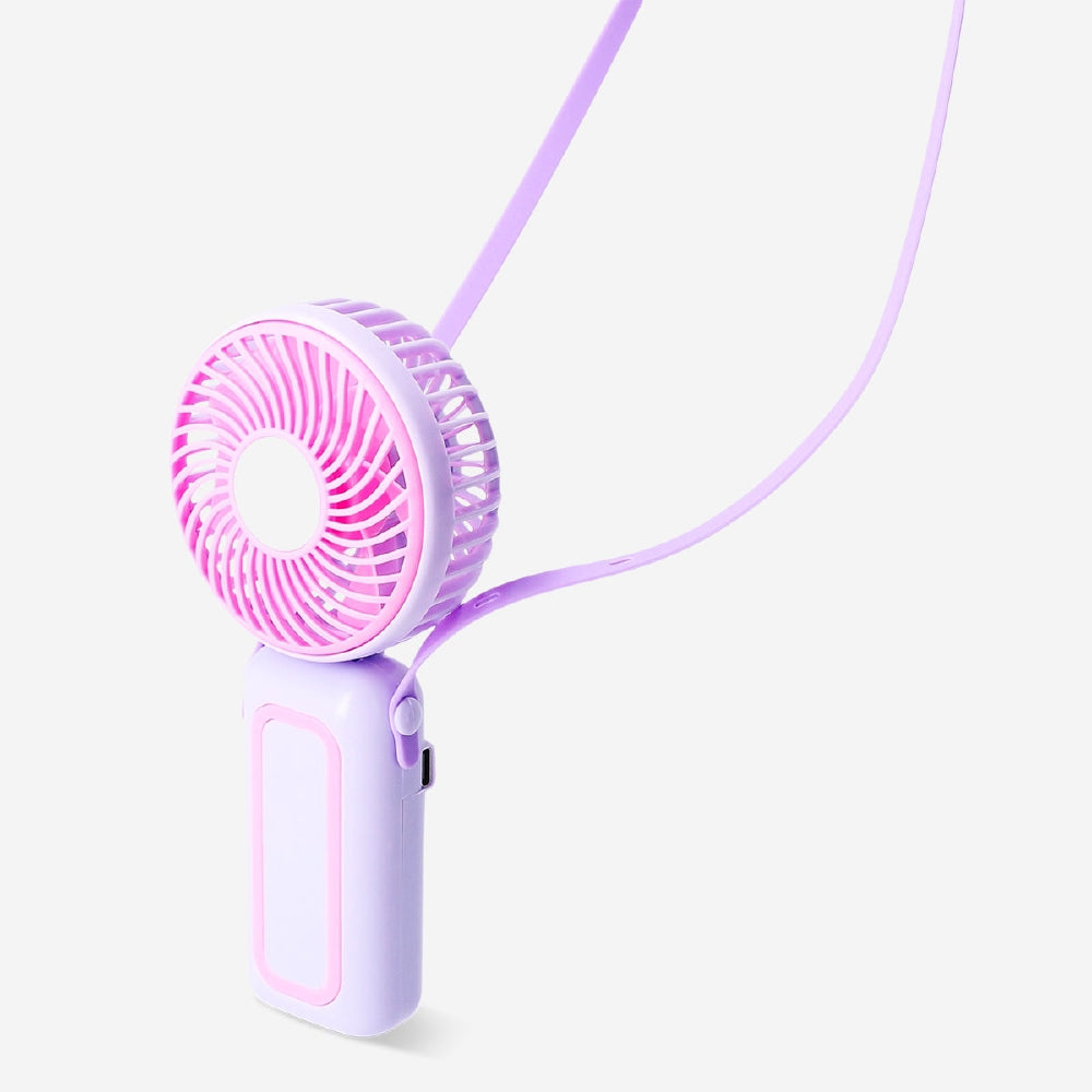Purple and pink handheld fan with strap from Flying Tiger Copenhagen, compact gadget perfect for personal cooling.