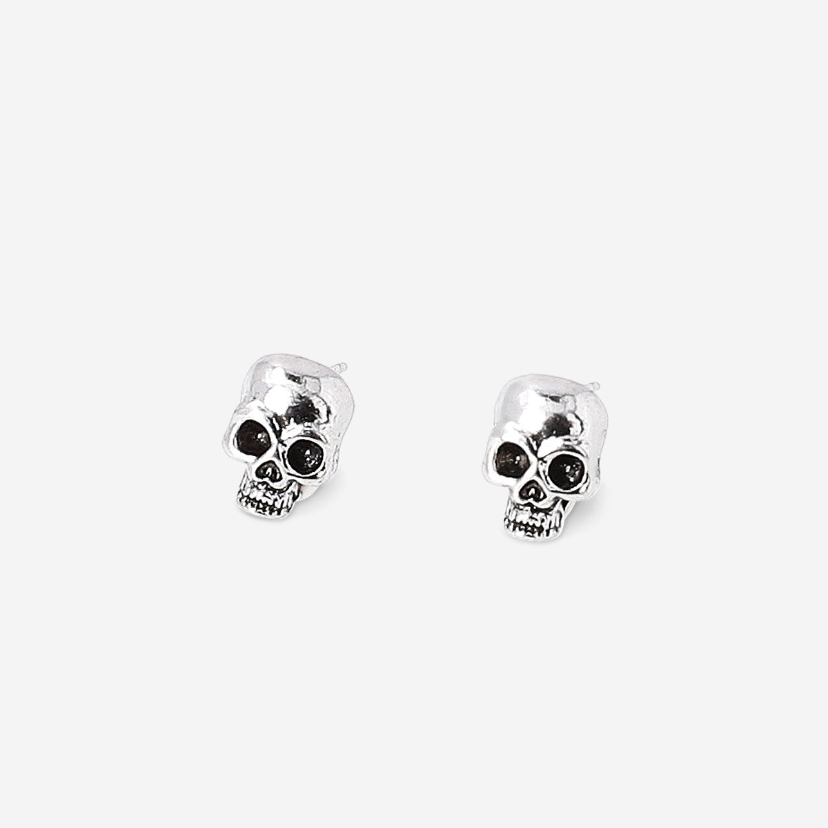 Silver skull stud earrings with textile backing from Flying Tiger Copenhagen, featuring a detailed skull design.