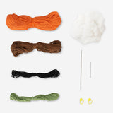 Flying Tiger Copenhagen crochet kit for making a pumpkin, including yarn and crochet tools, perfect for hobby craft projects.