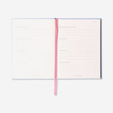 Flying Tiger Copenhagen five-minute office diary with open pages, compact design, and colorful cover for quick note-taking.