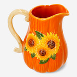 Ceramic jug with embossed sunflower design, 1.12L capacity, Flying Tiger Copenhagen kitchenware, white with yellow sunflower details.
