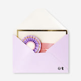 Colorful Flying Tiger Copenhagen birthday card with a decorative rosette, suitable for office celebrations.