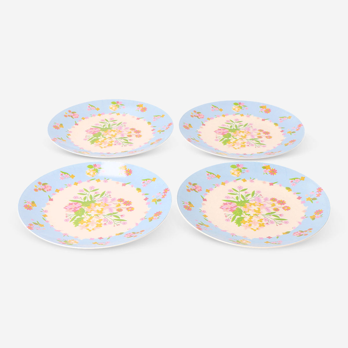 Set of four reusable floral party plates by Flying Tiger Copenhagen, featuring colorful flower designs for eco-friendly celebrations.