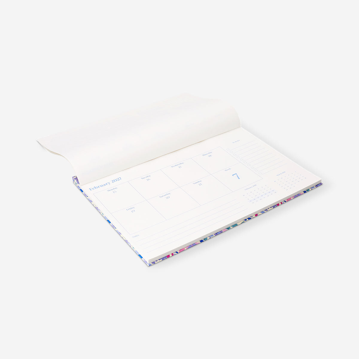 Floral weekly planner 2027 from Flying Tiger Copenhagen, featuring colorful floral cover and weekly layout for office organization.