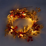 Flying Tiger Copenhagen red berry and gold leaf string lights for home decor, featuring festive red berries and shimmering gold leaves.