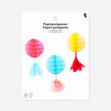 Three colorful paper pom poms for hanging, party decorations by Flying Tiger Copenhagen, bright and festive decor for celebrations.