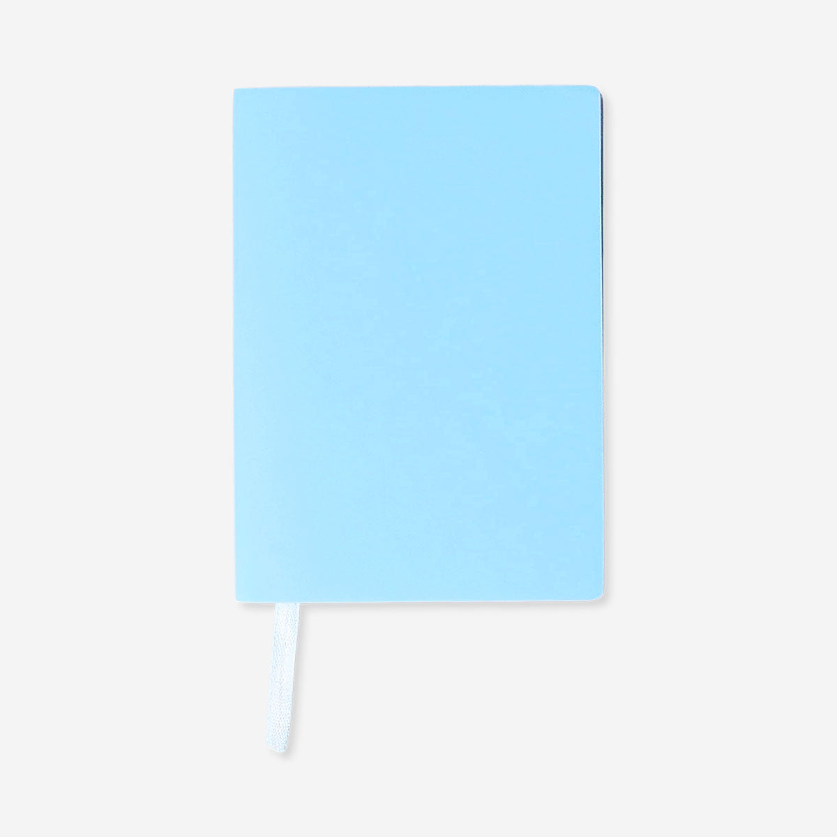 A6 office notebook with rainbow-colored edges and lined pages, branded Flying Tiger Copenhagen, shown open with pages visible.