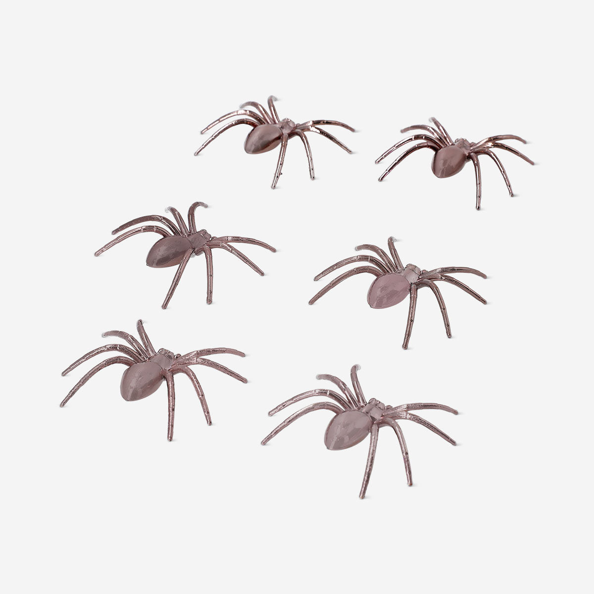 Six decorative metallic spiders for party decor, featuring shiny silver finish, perfect for Halloween or themed celebrations.