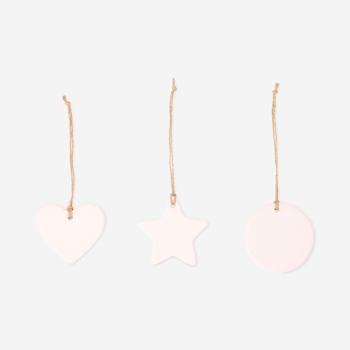 Set of three DIY ceramic ornaments for crafting hobby by Flying Tiger Copenhagen, featuring unpainted, blank ceramic surfaces.