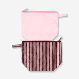 Pink and brown Flying Tiger Copenhagen leisure toiletry bags with zipper closures, made of durable fabric for travel organization.