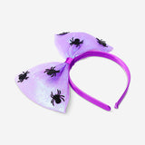 Iridescent kids' hairband with spider decorations, perfect for party costumes, by Flying Tiger Copenhagen.