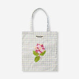 Flying Tiger Copenhagen floral and check print tote bag made of textile with colorful flower and check pattern design.