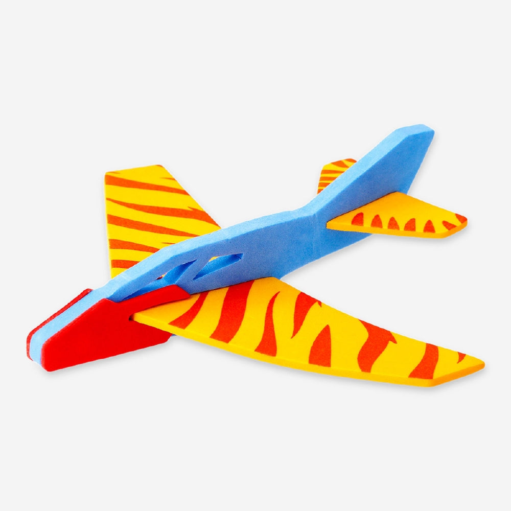 Mini glider plane toy from Flying Tiger Copenhagen, lightweight plastic aircraft for outdoor play and flight fun.